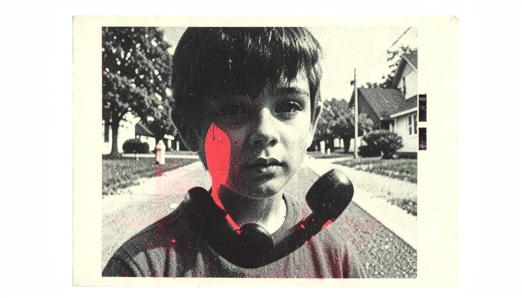 A two-ink risograph print in charcoal black and pale cream showing a boy's face half in shadow, a disconnected black phone receiver floating in the foreground against a suburban street backdrop.